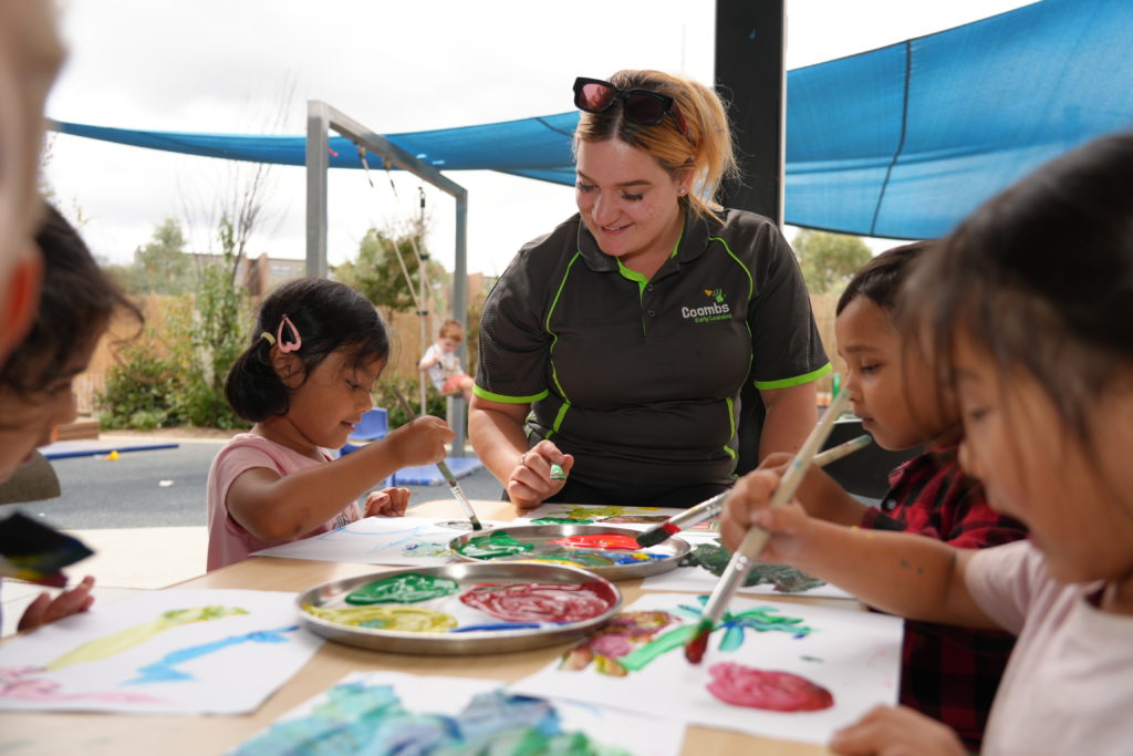 Educator doing painting with kids