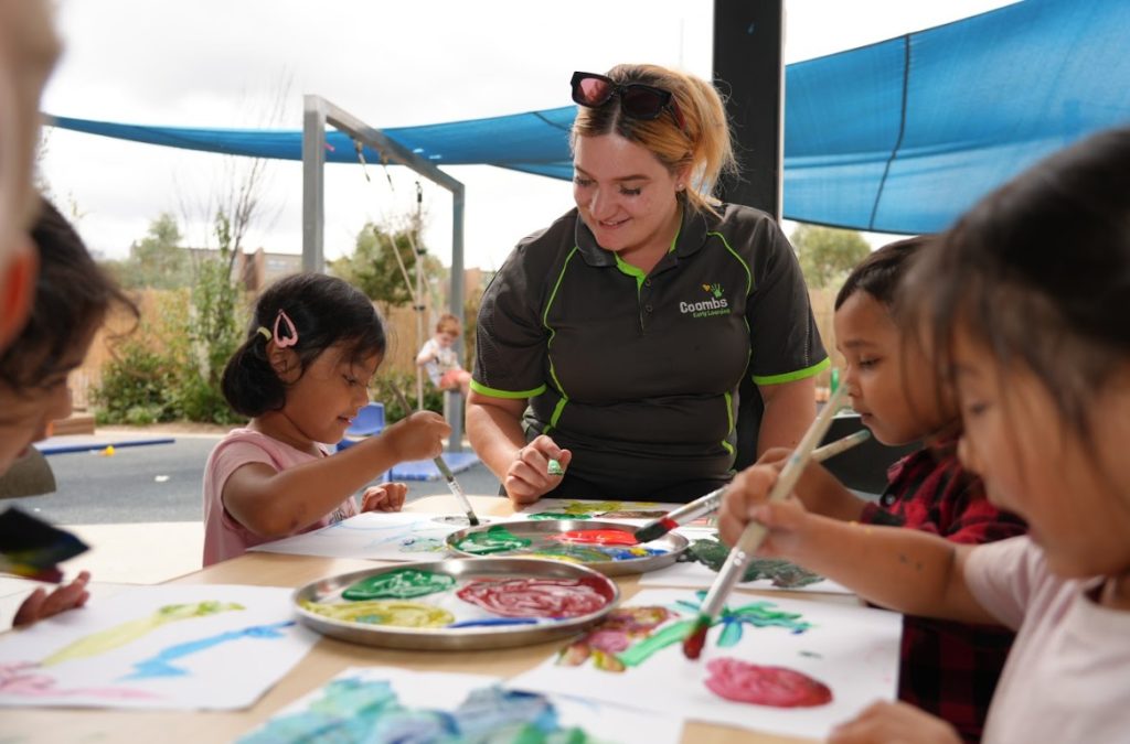 Educator doing painting with kids